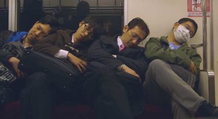 men-sleeping-on-train
